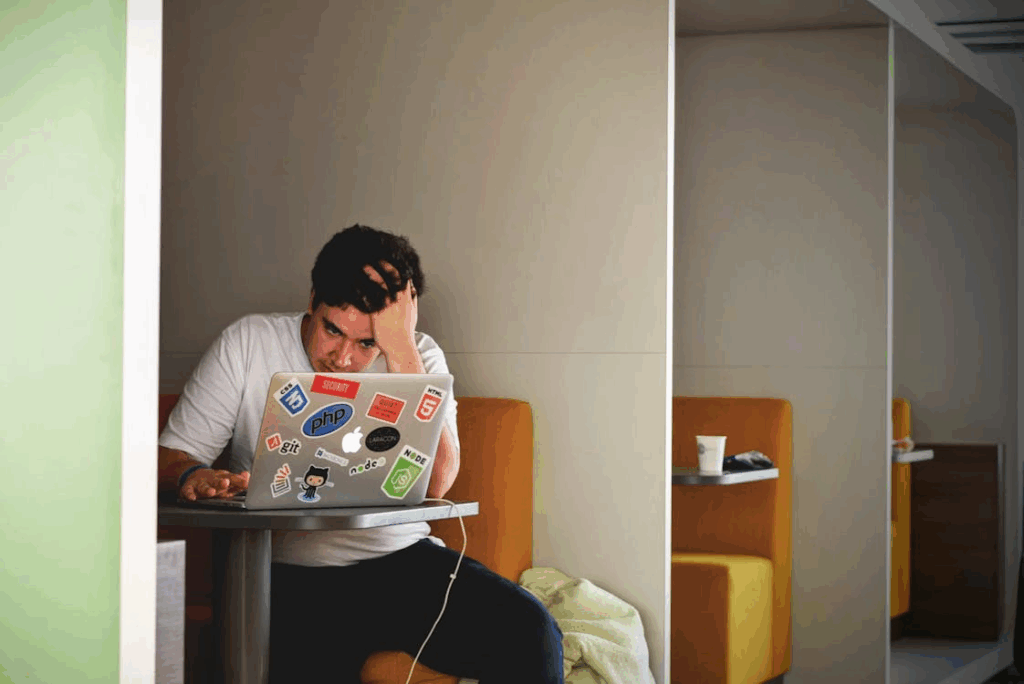 person on a computer screen irritated