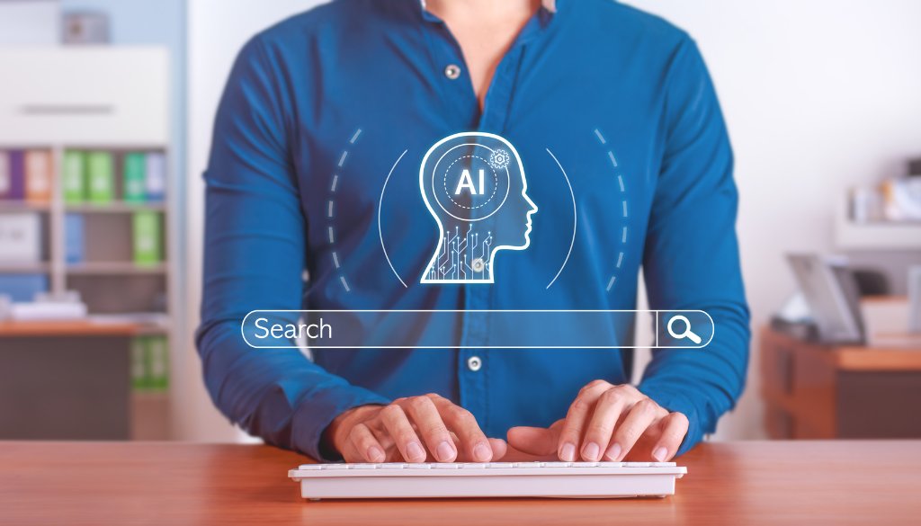 picture of a man typicing on a computer with ai search graphic on screen