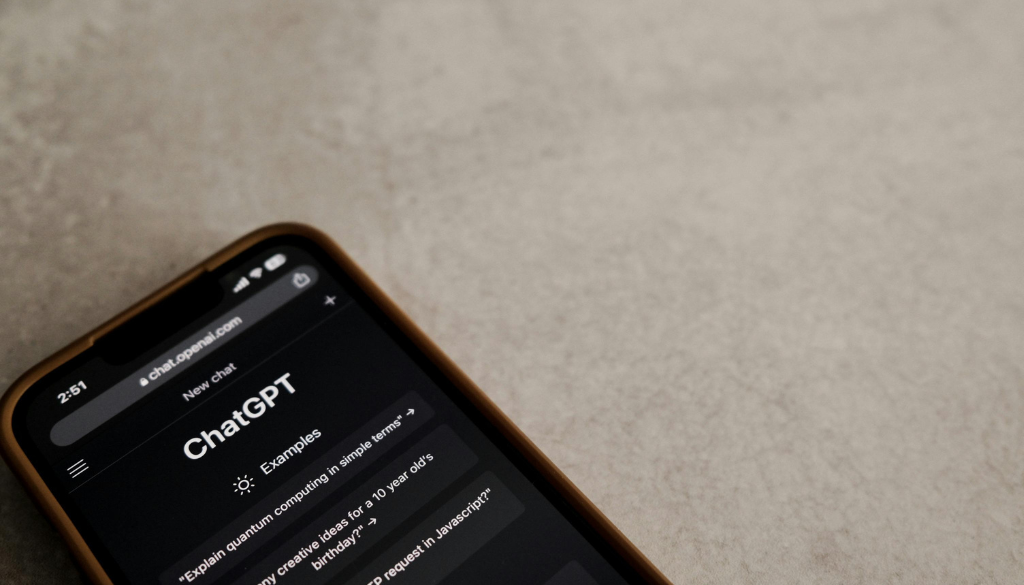 phone on a table with chatgpt app open