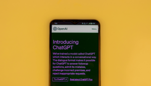 picture of a phone with chatgpt with a yellow background