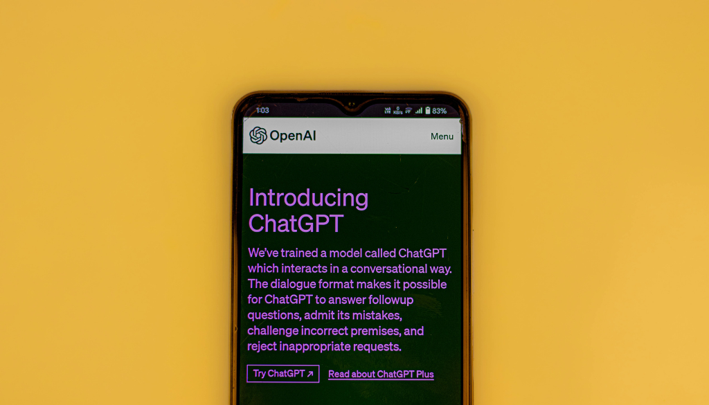 picture of a phone with chatgpt with a yellow background