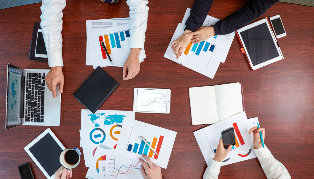 overhead picture of a group of people showing data